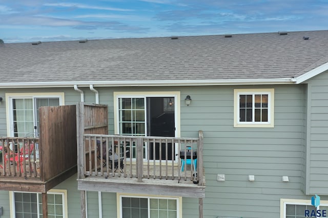 exterior space with a shingled roof