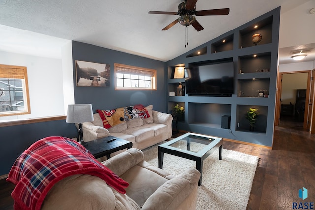 living room featuring a ceiling fan, hardwood / wood-style floors, vaulted ceiling, a textured ceiling, and built in shelves