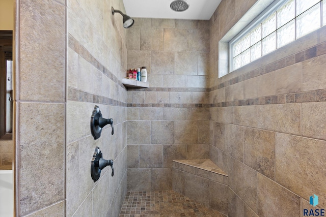 bathroom with tiled shower