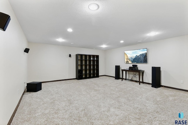 below grade area with carpet, baseboards, and recessed lighting