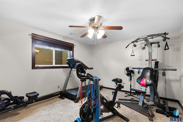 exercise room featuring ceiling fan and baseboards