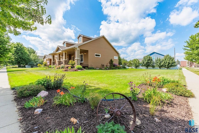 view of home's exterior with a porch and a lawn