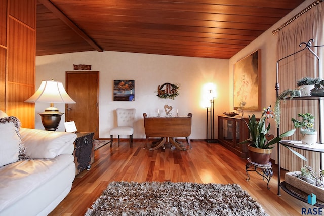 living room with wooden ceiling, vaulted ceiling with beams, and wood finished floors