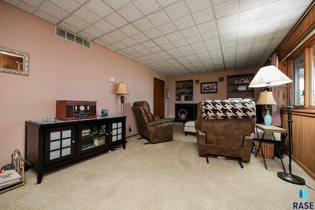 living room featuring carpet floors and visible vents