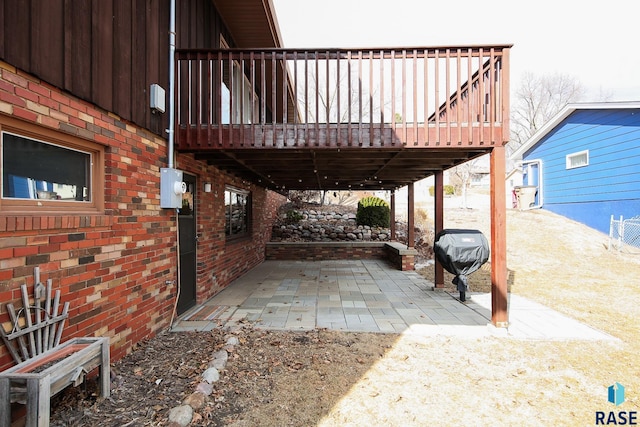 view of patio / terrace featuring a deck and grilling area