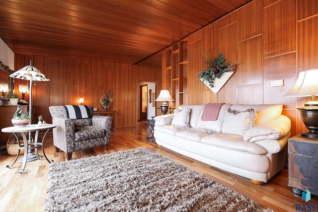 living room featuring vaulted ceiling, wood walls, wood finished floors, and wood ceiling