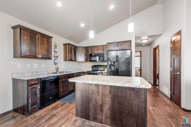 kitchen with dark brown cabinetry, dark wood-type flooring, a sink, a center island, and black appliances