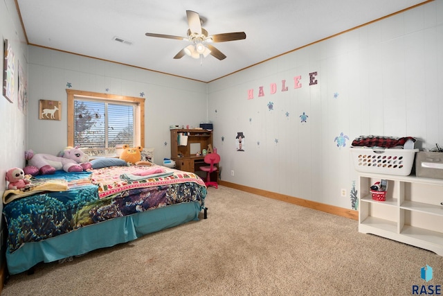 bedroom featuring ceiling fan, carpet flooring, visible vents, baseboards, and crown molding