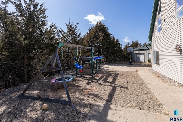 view of yard featuring a playground and an outdoor structure