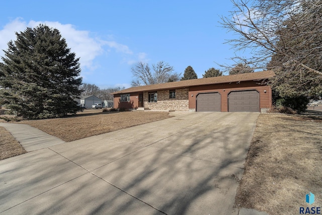 ranch-style house with driveway and an attached garage