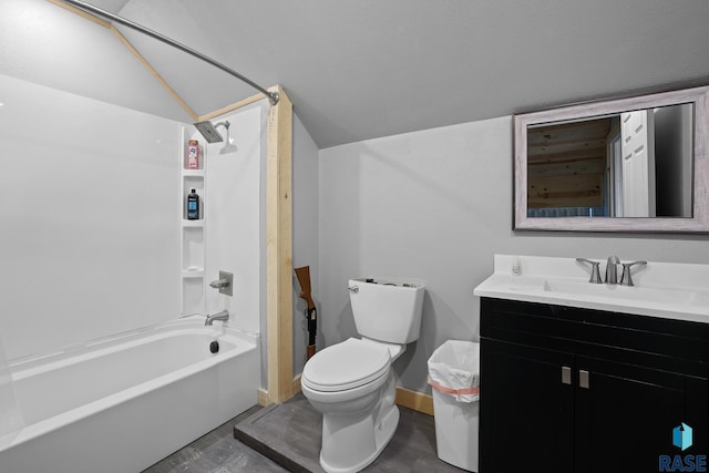 bathroom featuring lofted ceiling, bathtub / shower combination, toilet, vanity, and baseboards