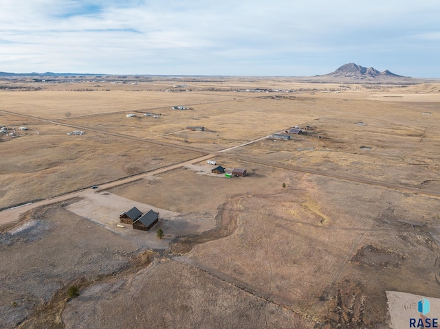 birds eye view of property featuring a rural view and a mountain view