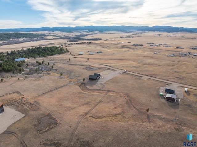 drone / aerial view with a rural view and a mountain view