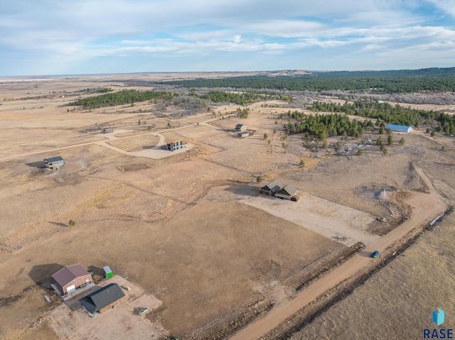 bird's eye view featuring view of desert and a rural view