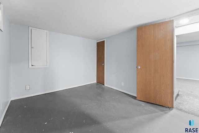 interior space with concrete floors and baseboards