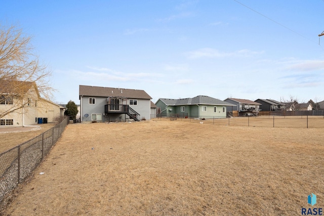 back of property featuring a fenced backyard