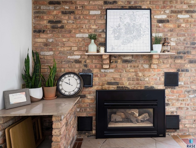 interior details featuring a fireplace and visible vents