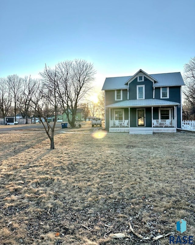 view of front of home featuring a porch and metal roof