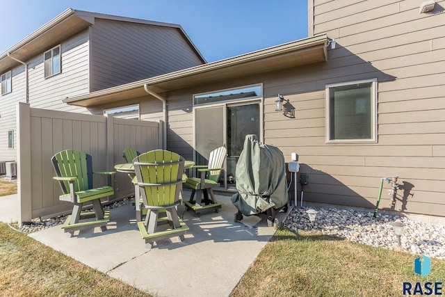 property entrance featuring a patio, central AC, and fence