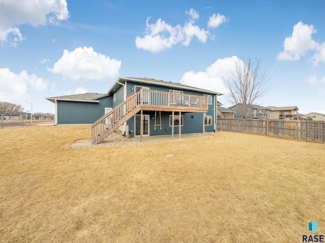 back of house featuring fence, stairway, and a wooden deck