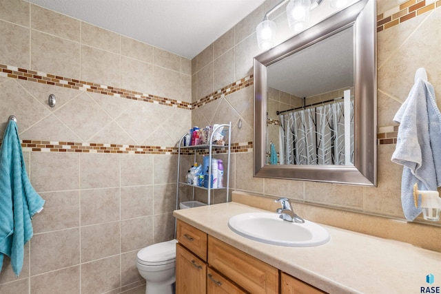 bathroom featuring curtained shower, toilet, vanity, tile walls, and decorative backsplash