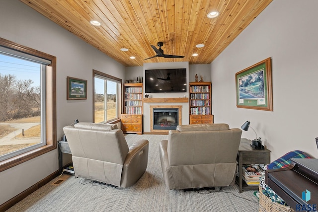 8501 E Torchwood Pl, Sioux Falls, SD 57110 - living room featuring a glass covered fireplace, wood ceiling, and recessed lighting