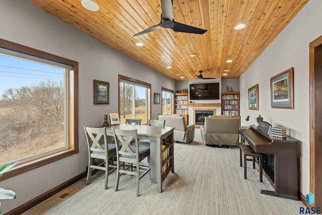 8501 E Torchwood Pl, Sioux Falls, SD 57110 - dining area featuring ceiling fan, wooden ceiling, a glass covered fireplace, and recessed lighting