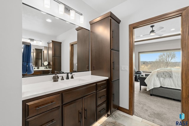 8501 E Torchwood Pl, Sioux Falls, SD 57110 - bathroom featuring a ceiling fan, vanity, and ensuite bathroom