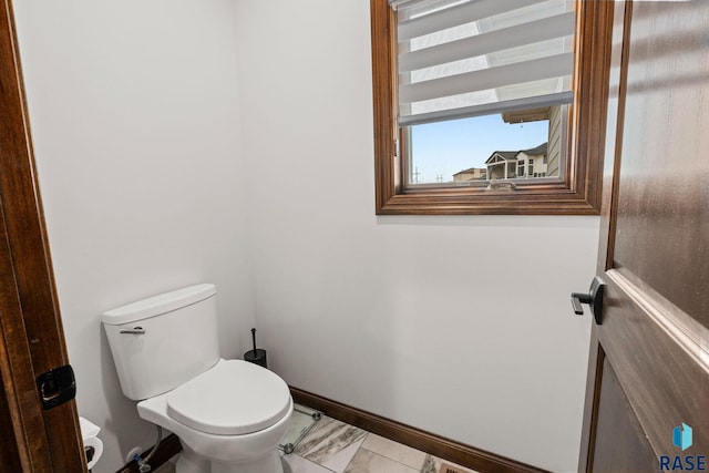 8501 E Torchwood Pl, Sioux Falls, SD 57110 - bathroom with marble finish floor, toilet, and baseboards