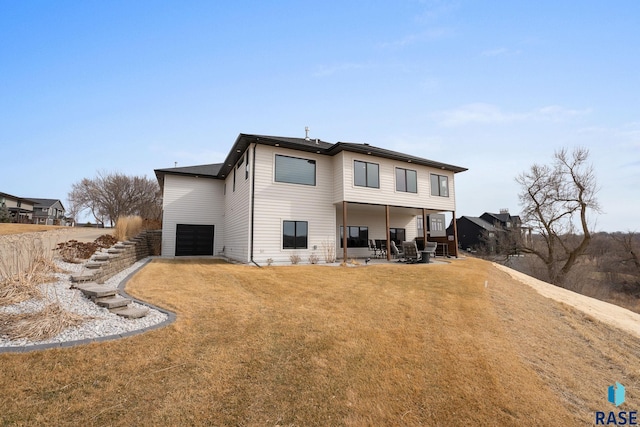 8501 E Torchwood Pl, Sioux Falls, SD 57110 - rear view of property with stairs, a patio, a lawn, and an attached garage