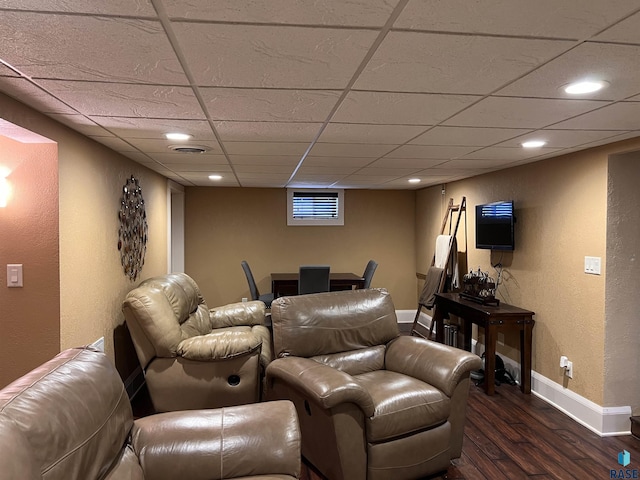 home theater featuring a paneled ceiling, baseboards, dark wood-style flooring, and recessed lighting