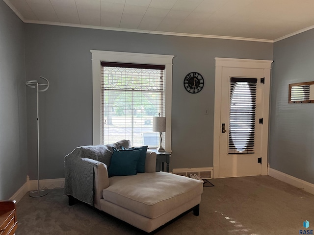 living area with baseboards, carpet flooring, and crown molding