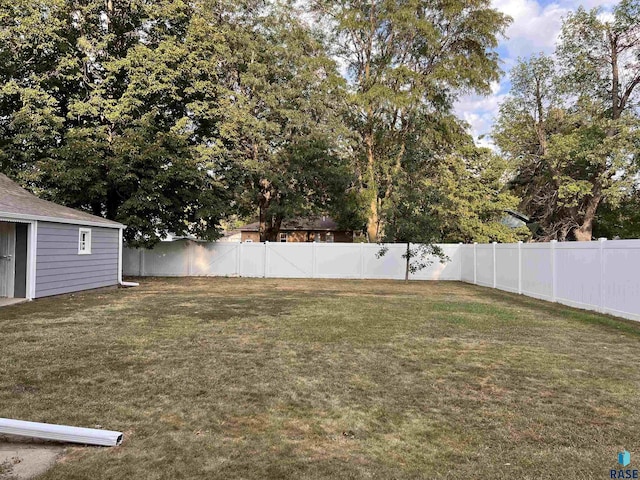 view of yard with a fenced backyard