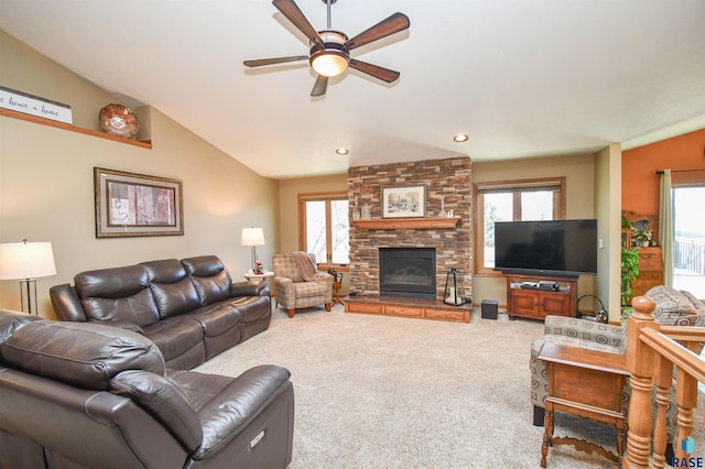 living room with ceiling fan, a stone fireplace, recessed lighting, carpet floors, and vaulted ceiling