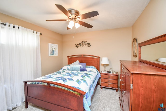 bedroom featuring ceiling fan and light colored carpet