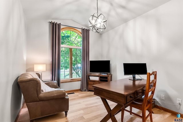 office space featuring a chandelier, lofted ceiling, baseboards, and light wood finished floors