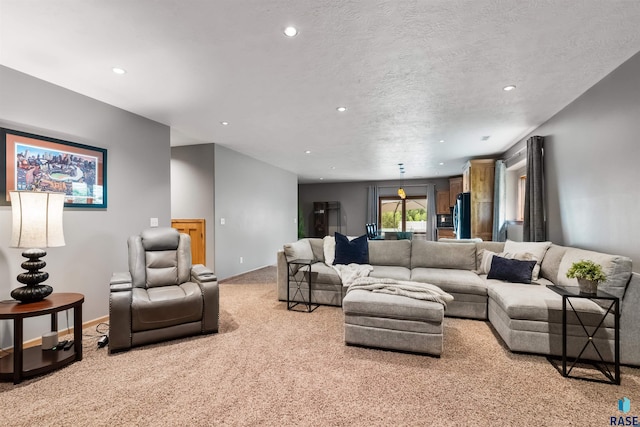 living room featuring a textured ceiling, carpet floors, and recessed lighting