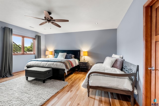 bedroom featuring visible vents, light wood-style flooring, and a ceiling fan