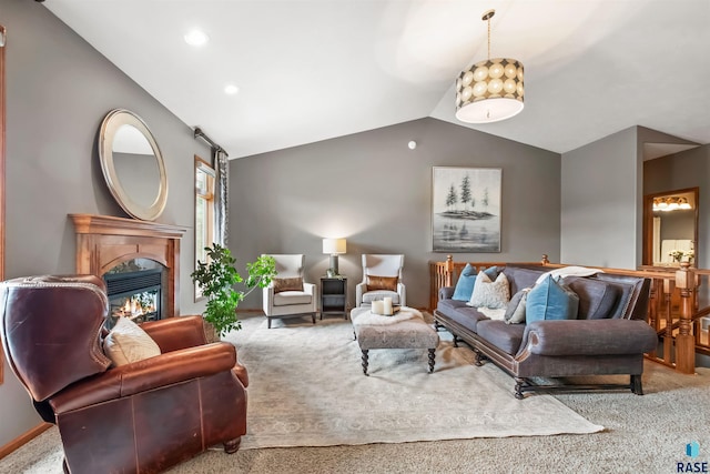 living room with carpet floors, a glass covered fireplace, vaulted ceiling, and recessed lighting