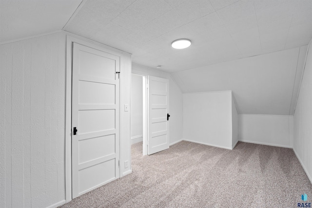 bonus room with carpet, lofted ceiling, and baseboards