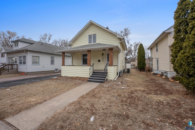 view of front of house with covered porch and roof with shingles