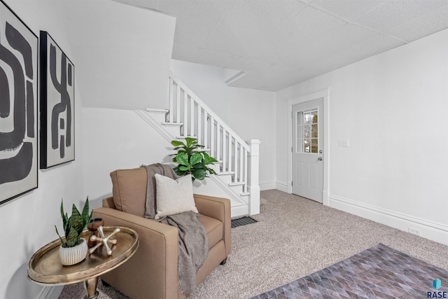 interior space featuring baseboards and stairs