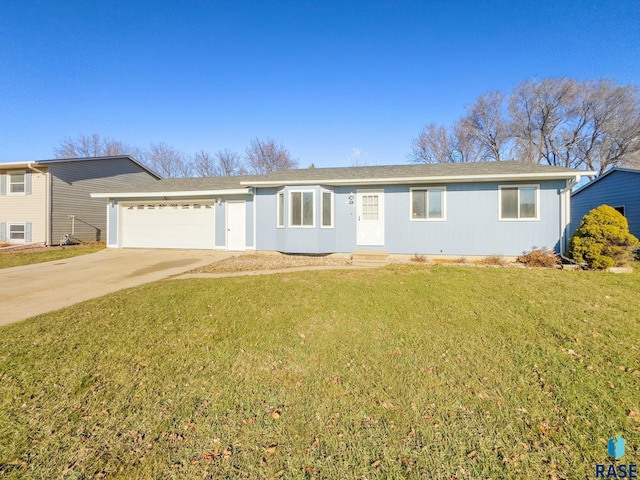 single story home featuring a garage, concrete driveway, and a front yard