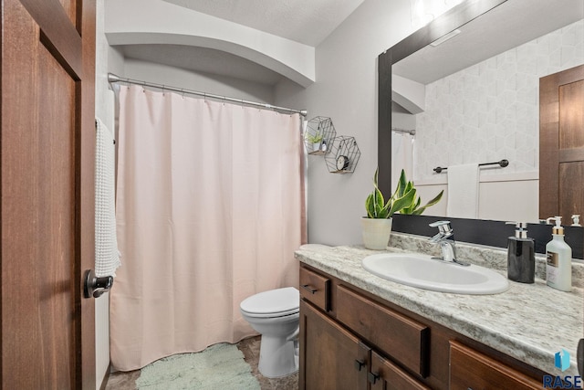 full bath featuring toilet and vanity