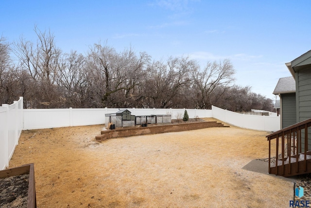 view of yard with a fenced backyard