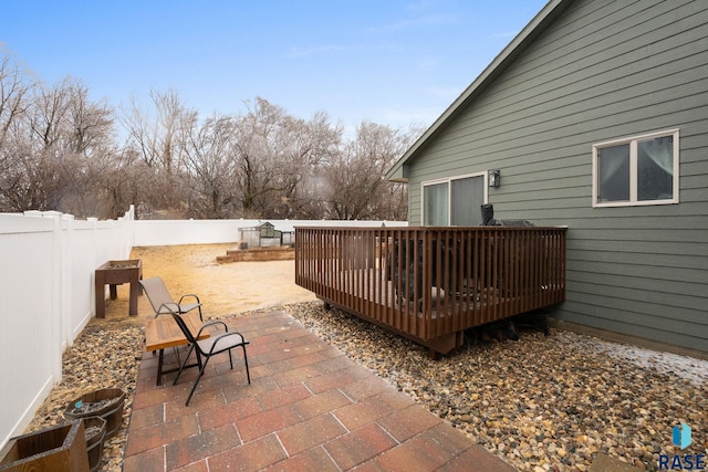 view of patio featuring a fenced backyard and a deck