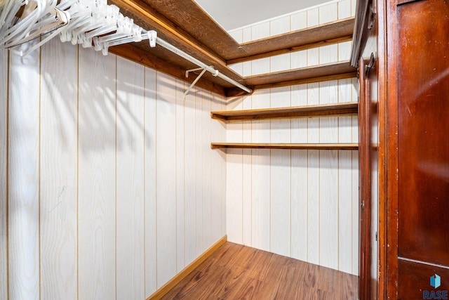 spacious closet with wood finished floors