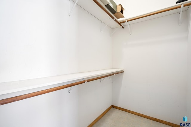 spacious closet with light floors