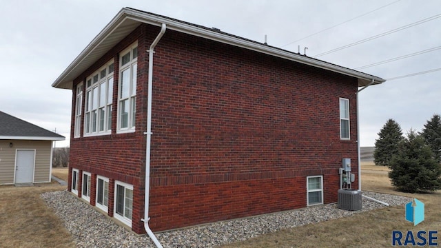 view of property exterior with brick siding