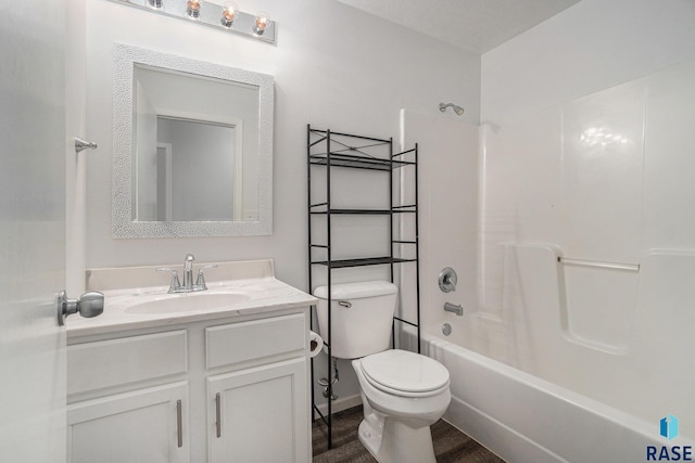 full bath featuring washtub / shower combination, vanity, and toilet